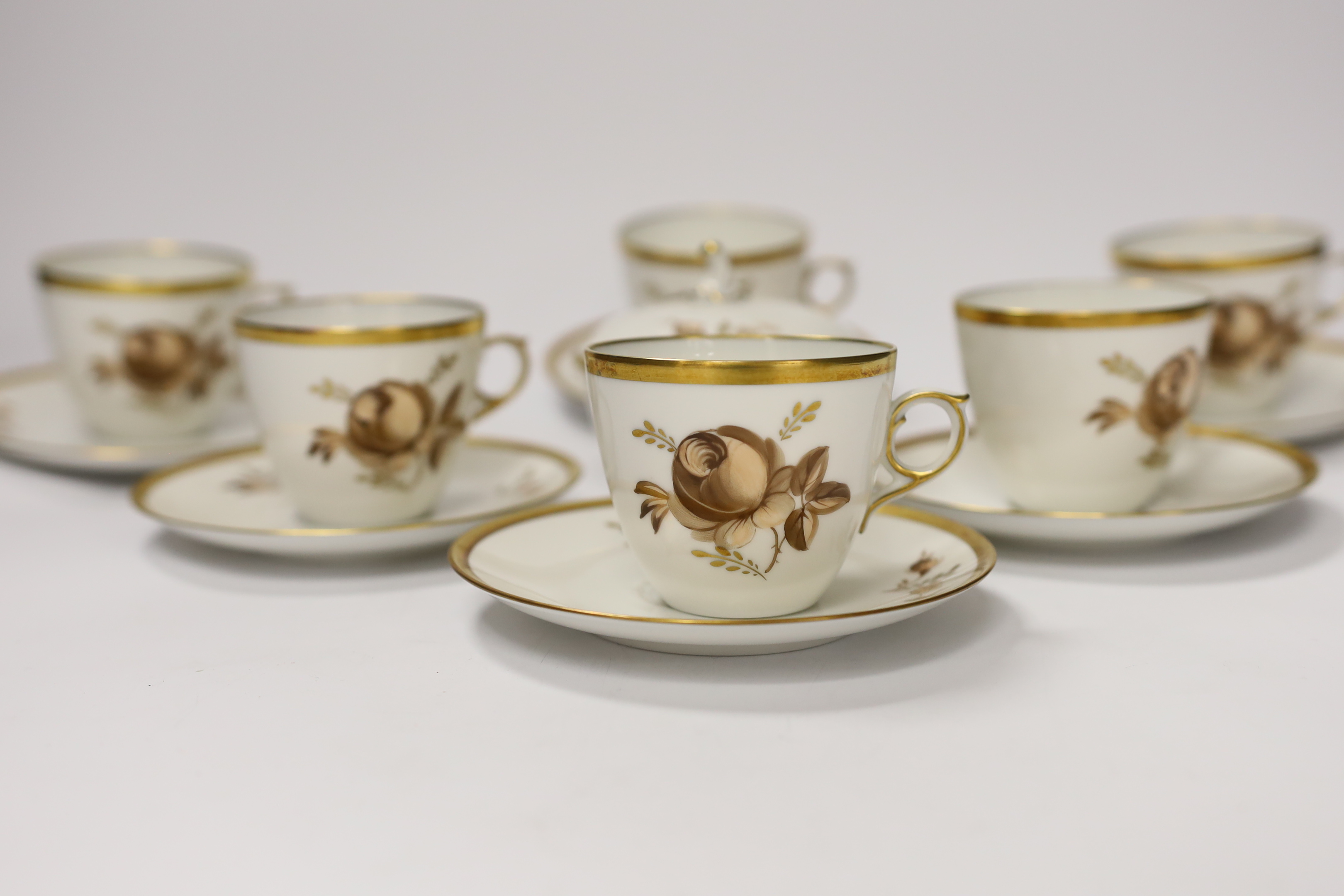 A Royal Copenhagen part coffee set comprising six cups and saucers and a jar and cover, largest 12.5cm in diameter